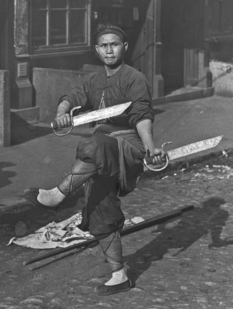 Sword dancer in San Francisco's Chinatown, by Arthur Genthe, 1896-1906